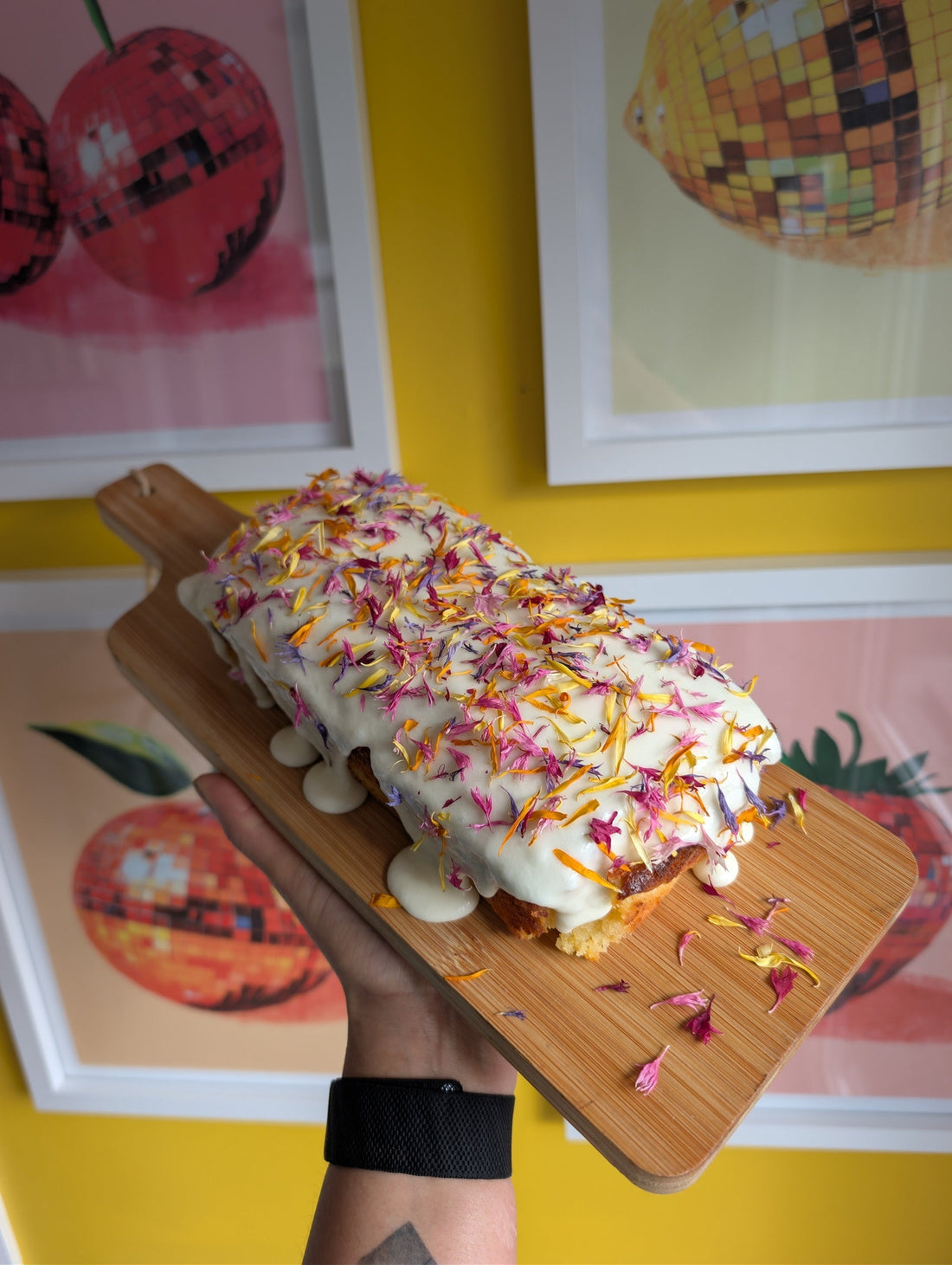 Lemon drizzle cake topped with colourful Carnival Crush dried edible flowers